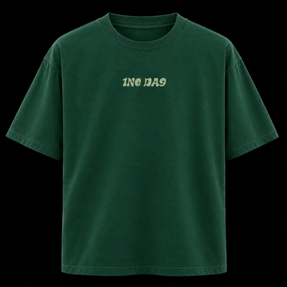 A dark green short-sleeve t-shirt with the text 'ONE DAY' printed in a light beige retro font on the chest, displayed against a solid black background.